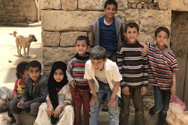 Yemen: Humanitarian Crisis Young children pose for the camera in Amran's Old City in Amran Governorate. ; Civilians in Yemen continue to bear the brunt of the crisis as conflict prolongs and escalates with many of those most affected and vulnerable at risk of exploitation or abuse and turning to negative survival strategies to cope in exile such as through child labour, early marriage and begging.