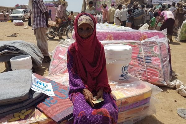 Yemen. UNHCR aid convoys reach Mokha Thousands of displaced Yemenis from villages in the district of Mokha receive mattresses, sleeping mats, blankets, kitchen sets and wash buckets at a UNHCR distribution point. ; After weeks of negotiations, UNHCR reached the district of Mokha in Yemen’s western governorate of Taizz on 20 March 2017. Hostilities between the warring parties have escalated here since the beginning of the year and the intensified fighting has led to tens of thousands being forcibly displaced. UNHCR teams distributed emergency aid to over 3,400 people in the first few days after gaining access. Many are traumatised and living in desperate conditions, lacking water and sanitation. At the time these pictures were taken, two million people were displaced across Yemen and one million had returned home to precarious conditions. Despite the desperate human suffering, by late-March 2017 UNHCR had received less than $10 million of the $99 million it needs to respond to the looming humanitarian catastrophe. We are appealing for urgent international support.